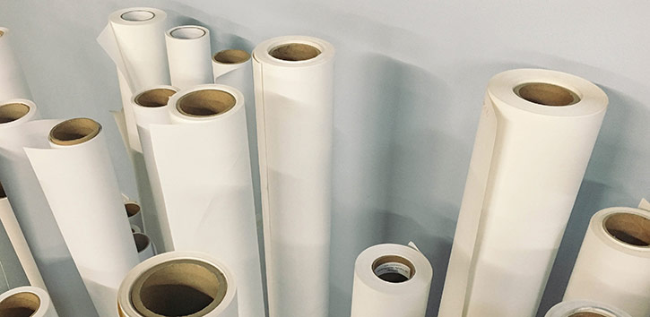 Media substrates on rolls standing up.